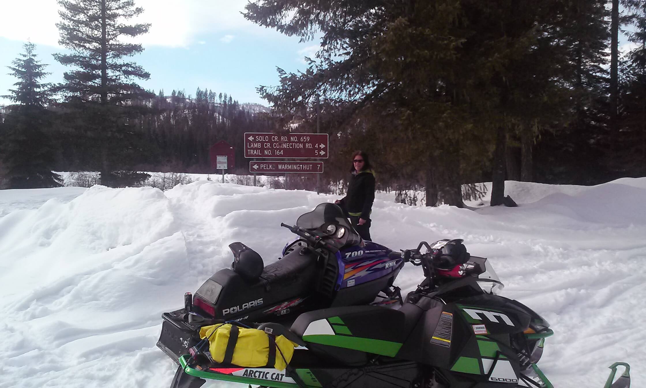 woman with snowmobile