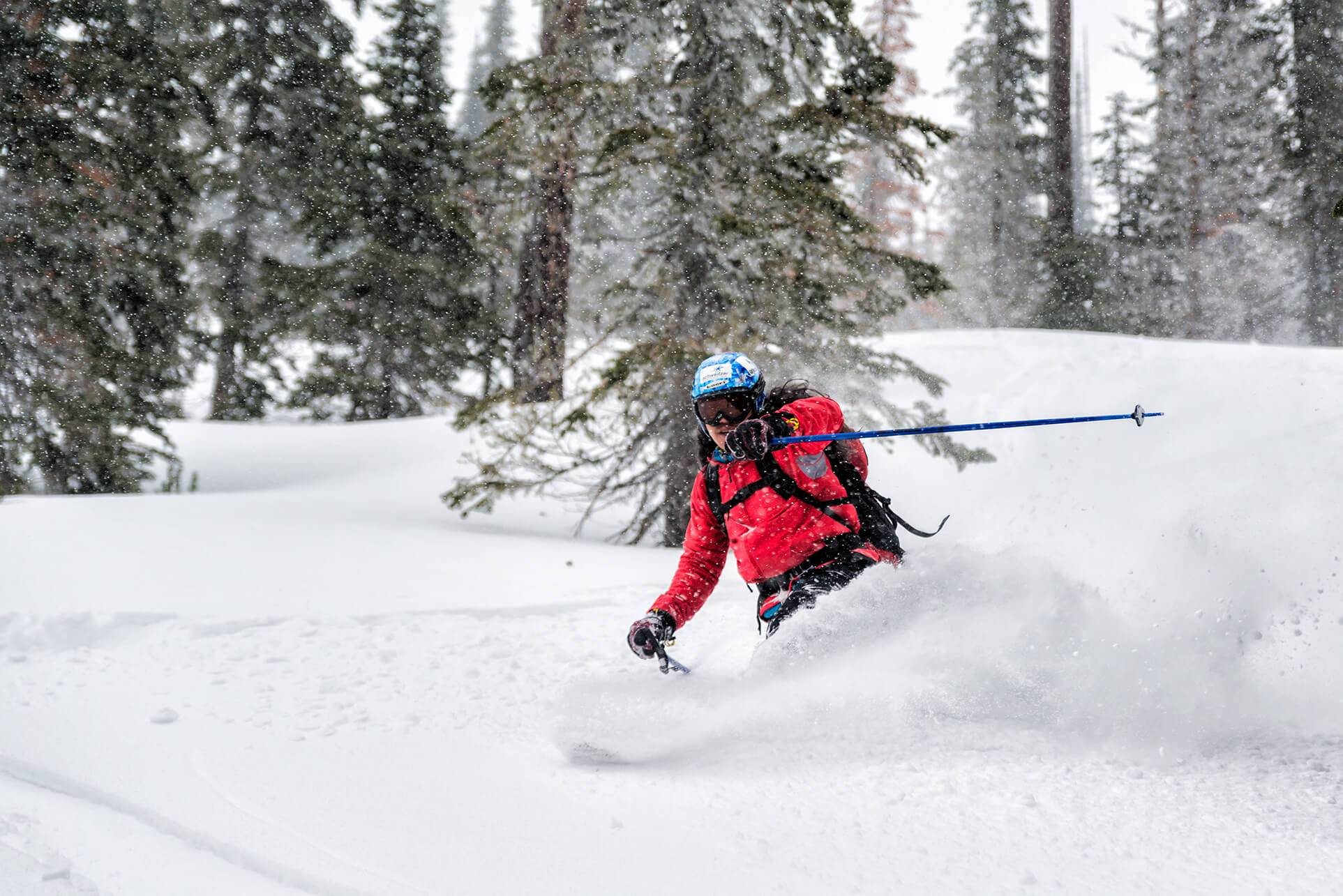 a person skiing through a forest