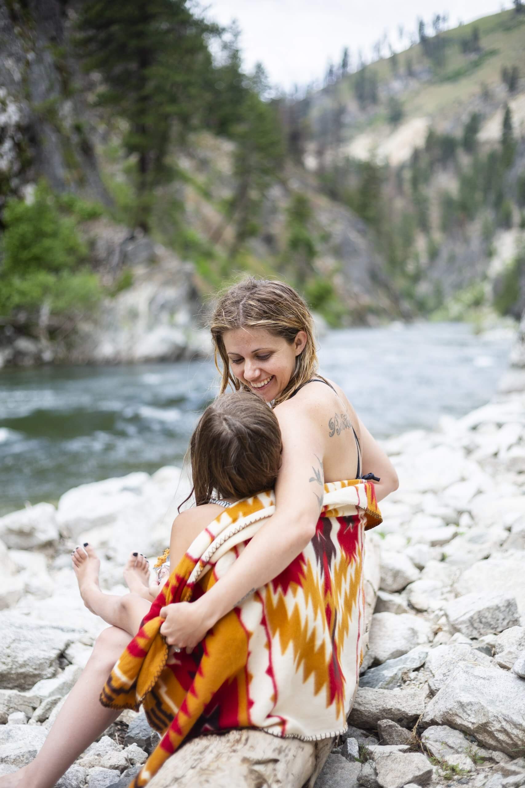 A family enjoying a soak in a natural hot springs.