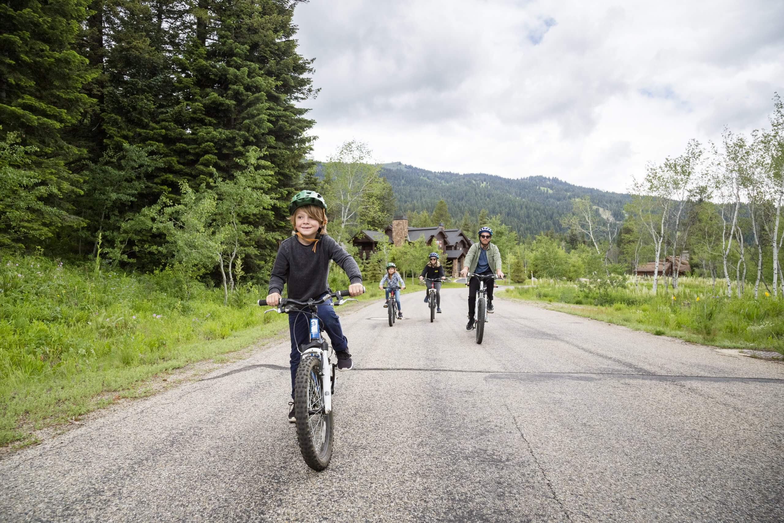 A family mountain biking near Tamarack Resort.