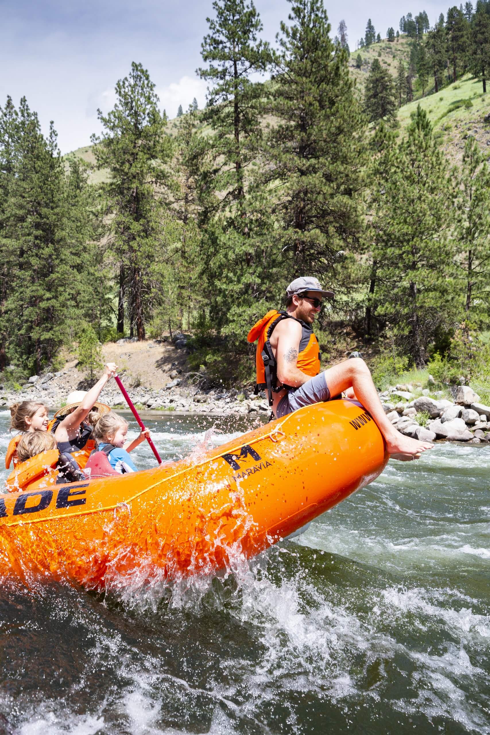 A family rafting on a river.