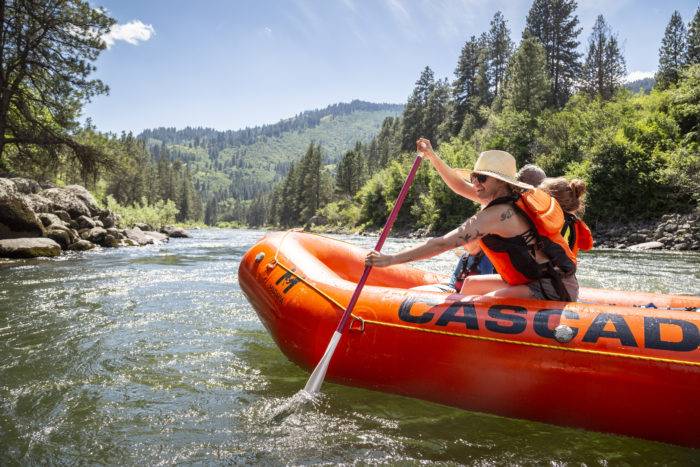 A family rafting on a river.