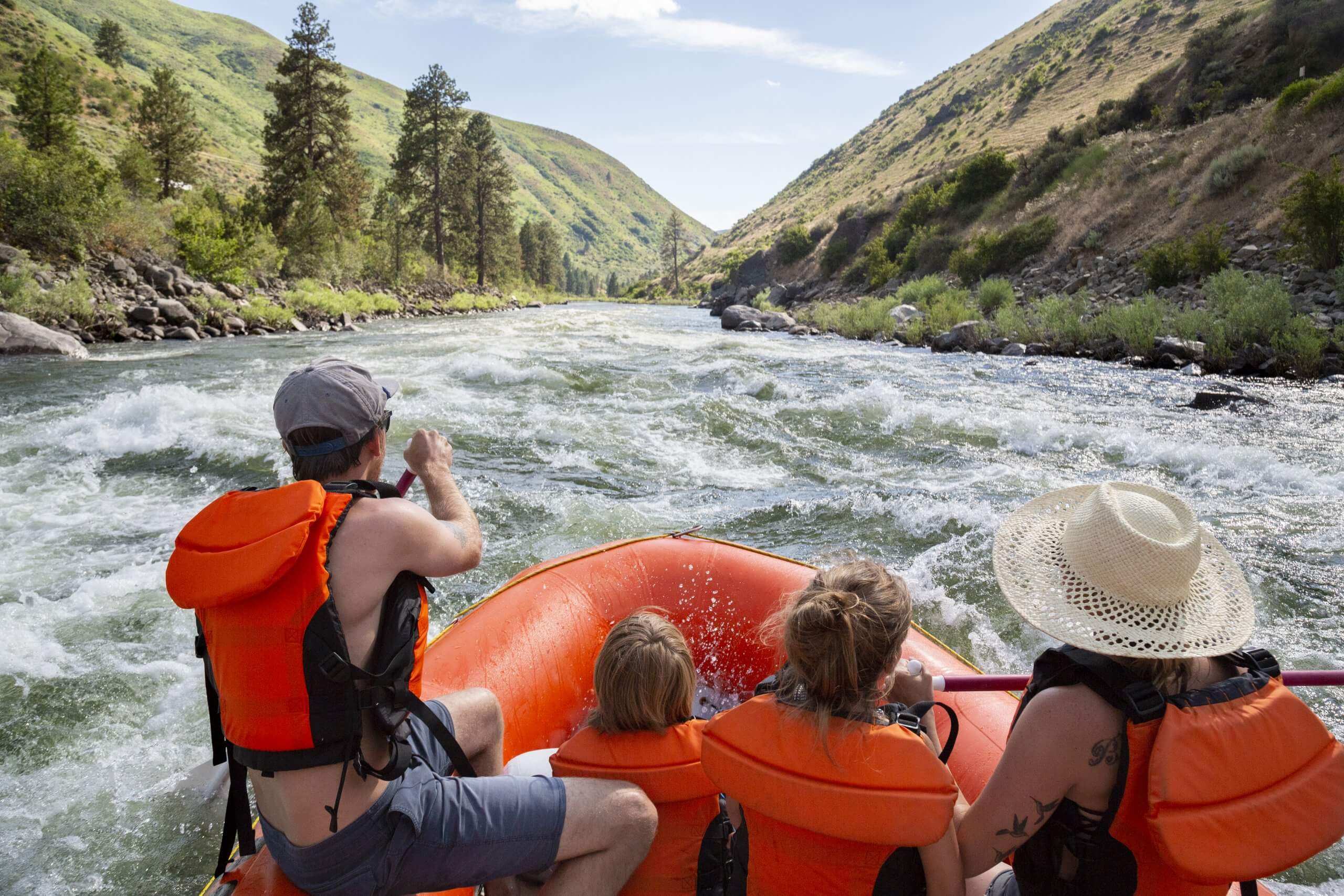 A family rafting on a river.