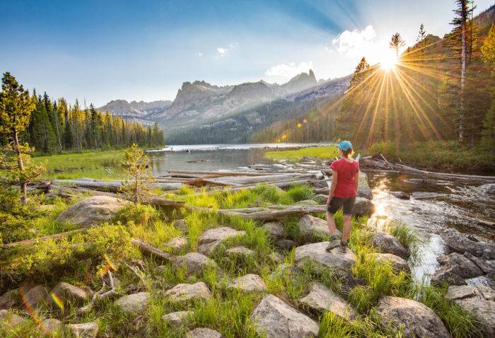 Hiking near a lake in the Sawtooth Mountains.