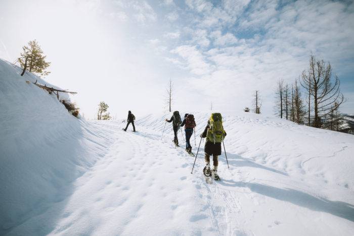 people snowshoeing