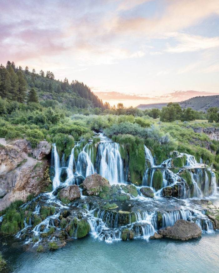 A waterfall flowing into a river.