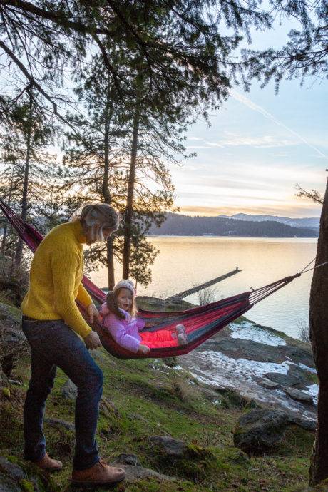 child with parent in hammock