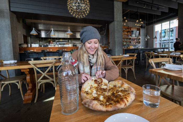 woman eating pizza