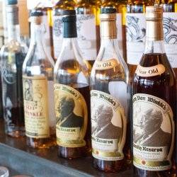 whiskey bottles on a shelf