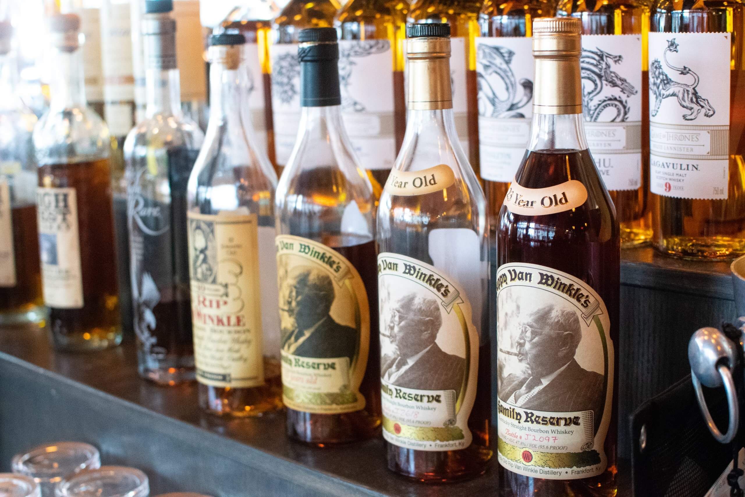 whiskey bottles on a shelf