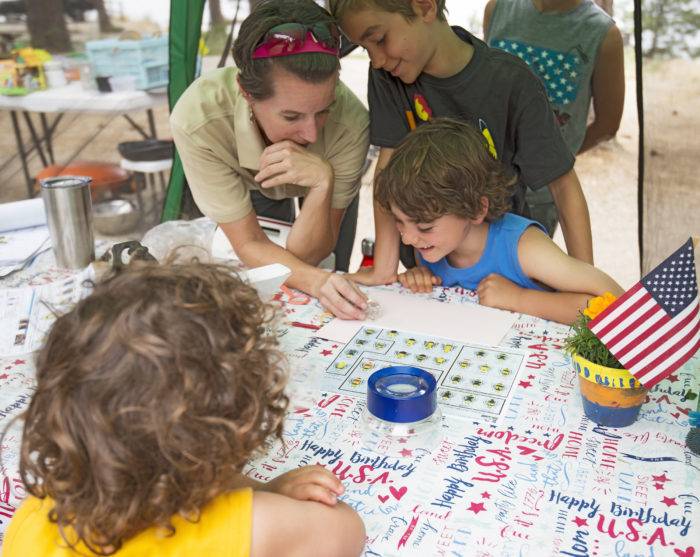 kids working with a park ranger