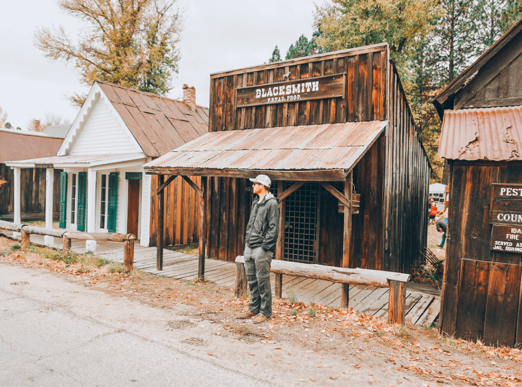 standing outside historic building in Idaho City