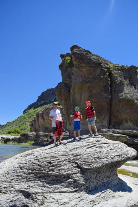 family standing on rock - pillar falls