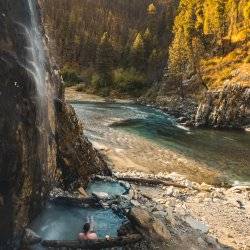 man siting in water at pine flats hot spring