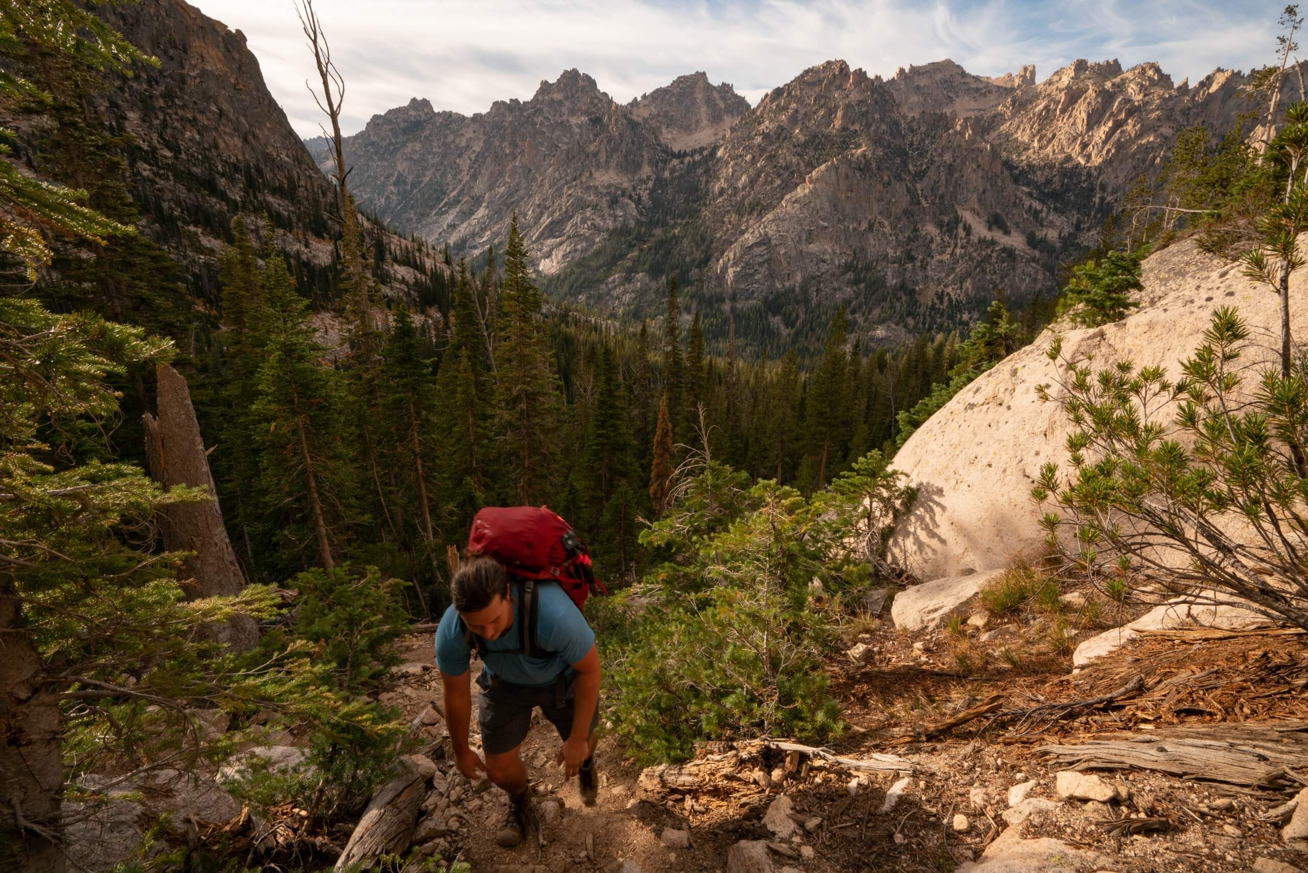 hiking near stanley, man climbing mountain