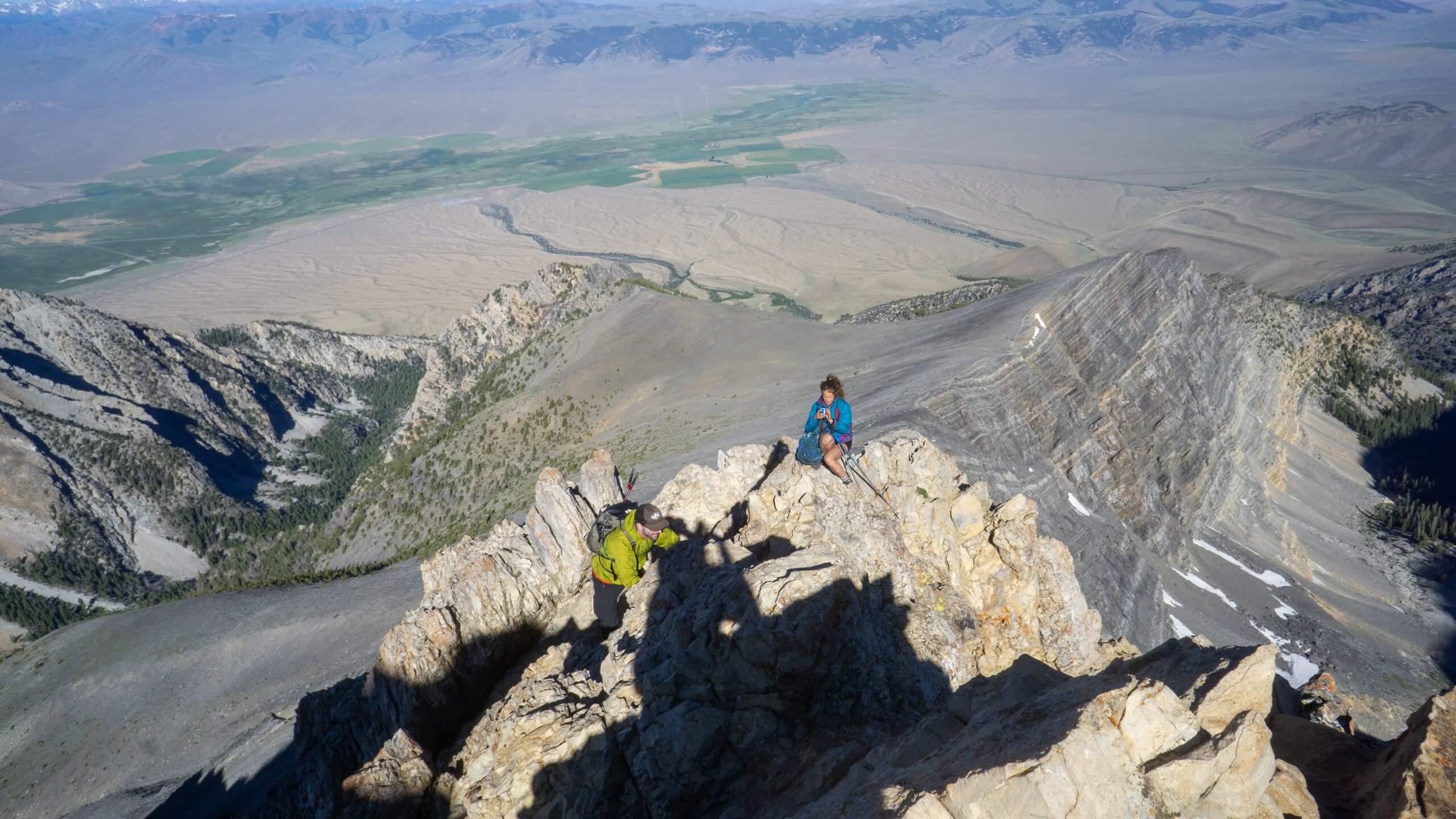 person climbing mount borah