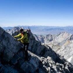 man climbing mount borah