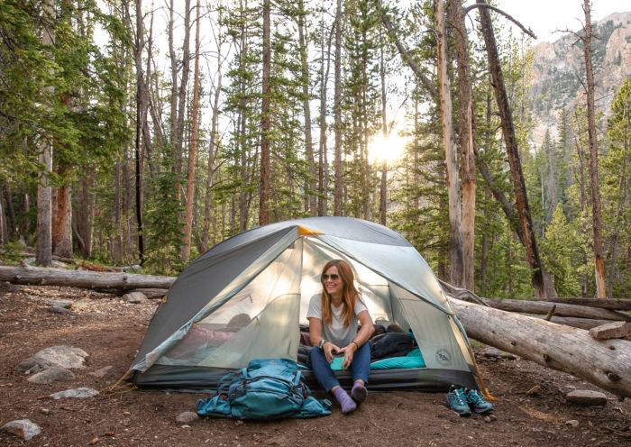 woman sitting in tent