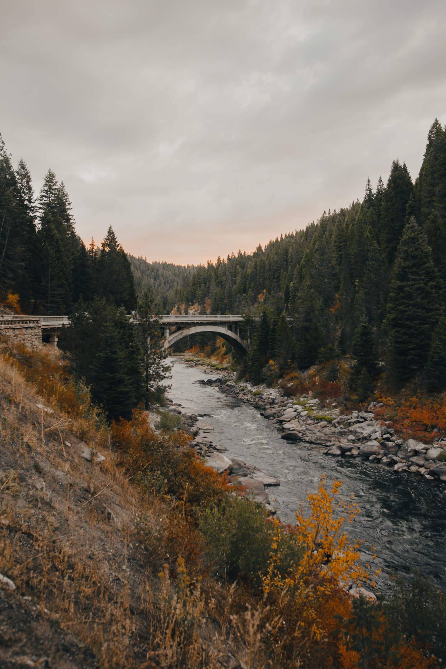 bridge over river with fall colors