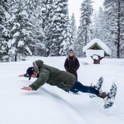 man jumping in snow