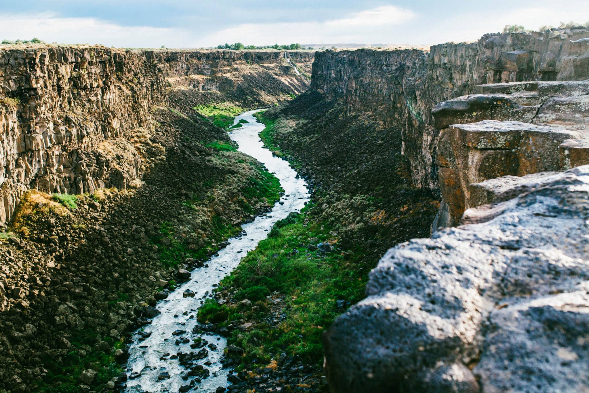 Scenic view of Malad Gorge near Hagerman, Idaho, featuring rugged canyon walls and a winding river below.