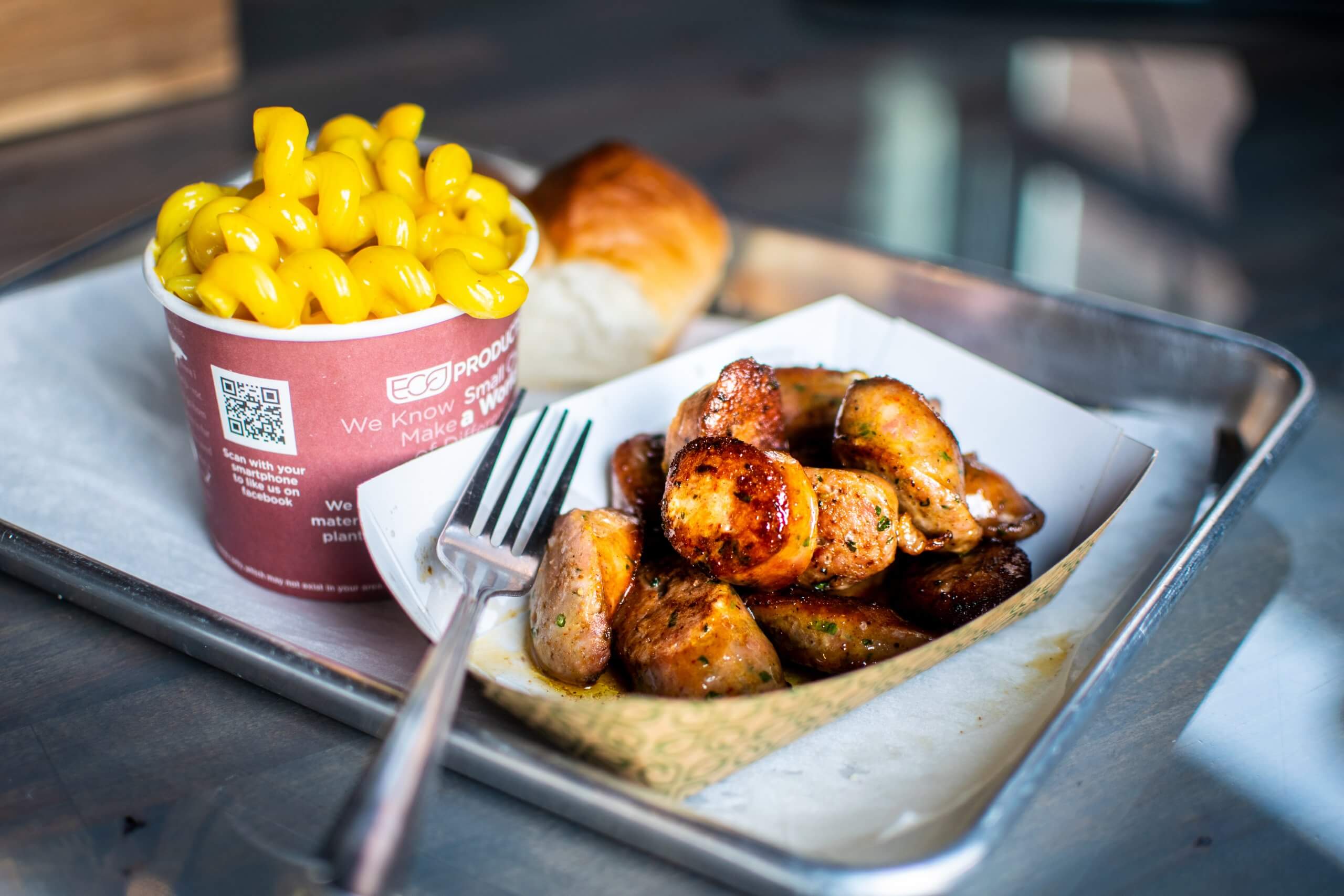 Barbecued sausage and a bowl of mac and cheese at Chop Shop BBQ.