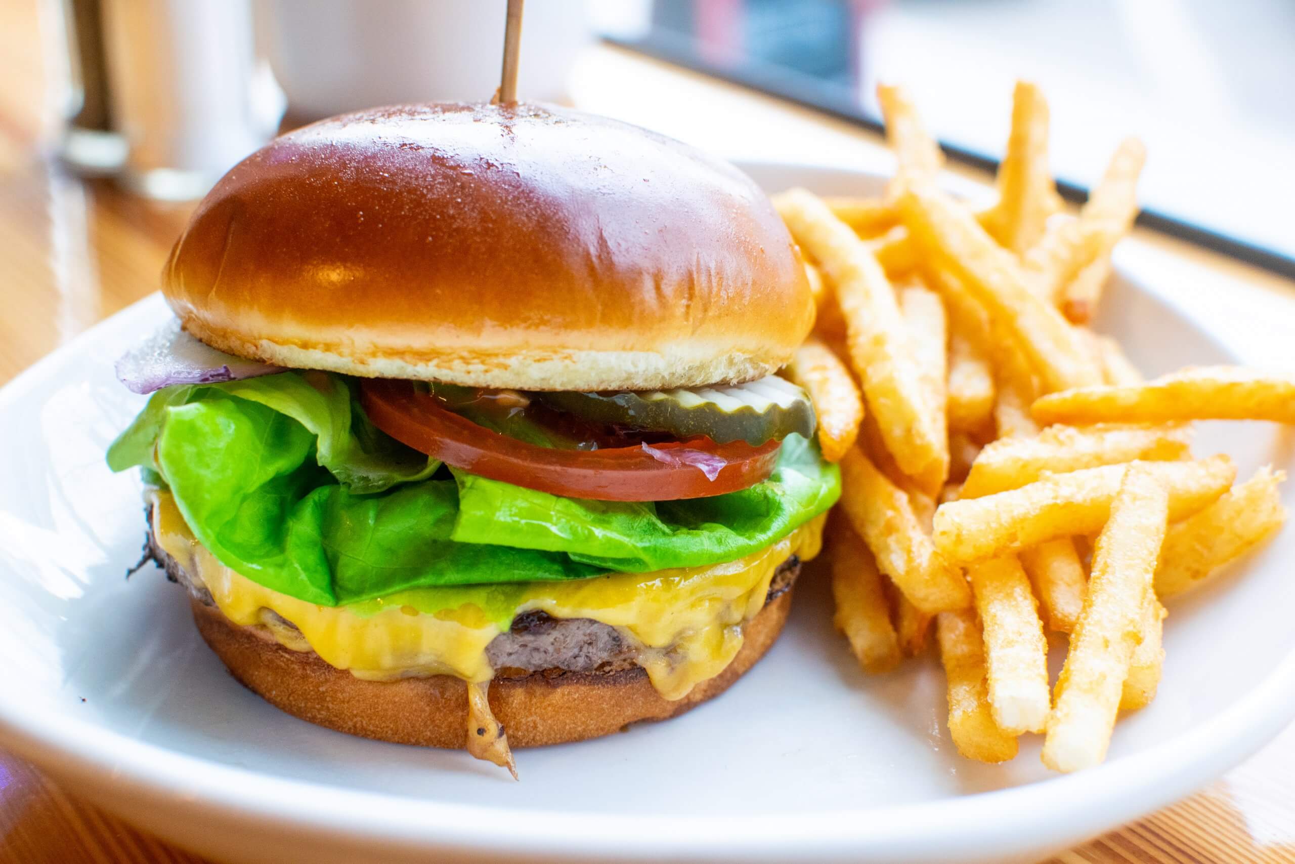 A burger with french fries at Holy Cow.