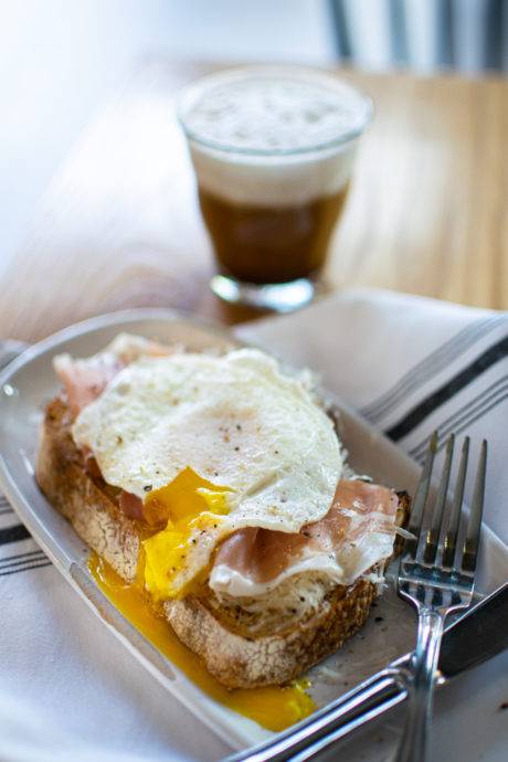 coffee and breakfast sandwich