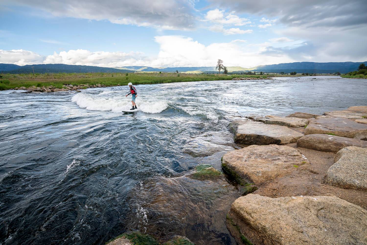 man surfing at Kelly's Whitewater Park