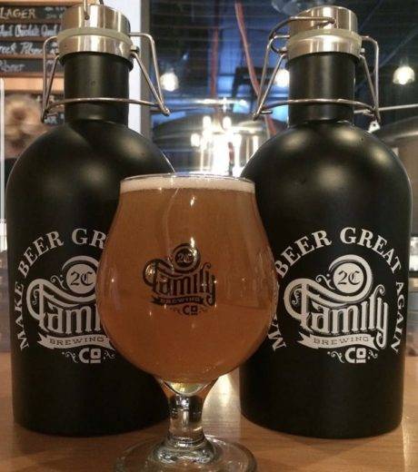 pint glass with beer and growlers