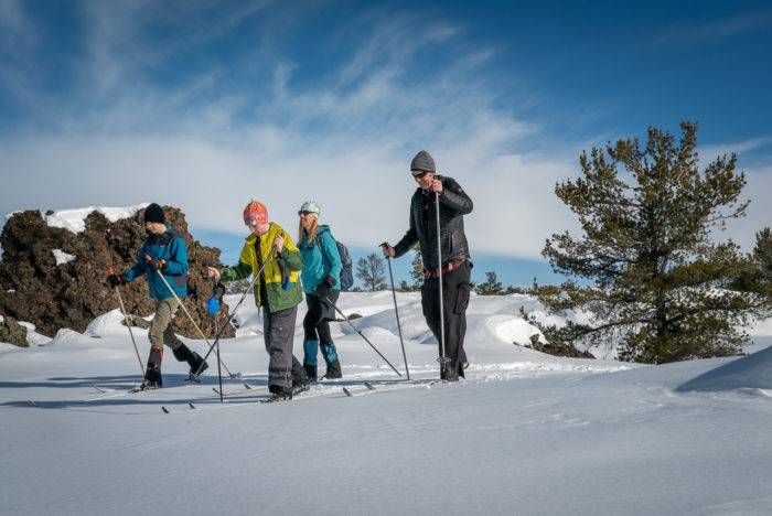 family cross country skiing at craters of the moon