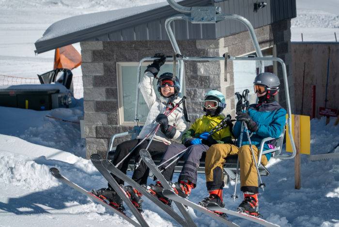 family on ski lift