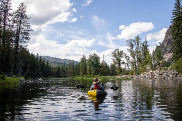 person paddling kayak