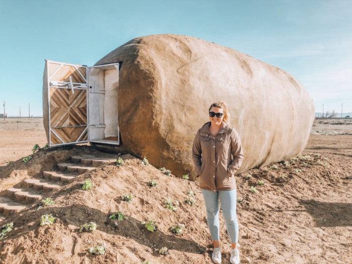 woman in front of potato hotel