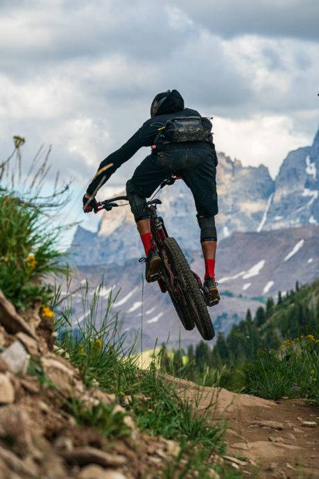 man mountain biking in teton valley