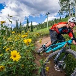 man cycling on mountain trail