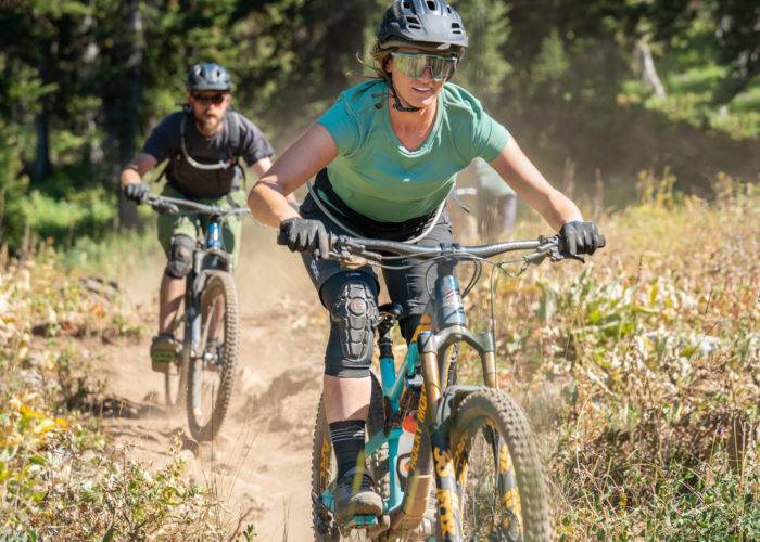 man and woman mountain bike riding teton valley