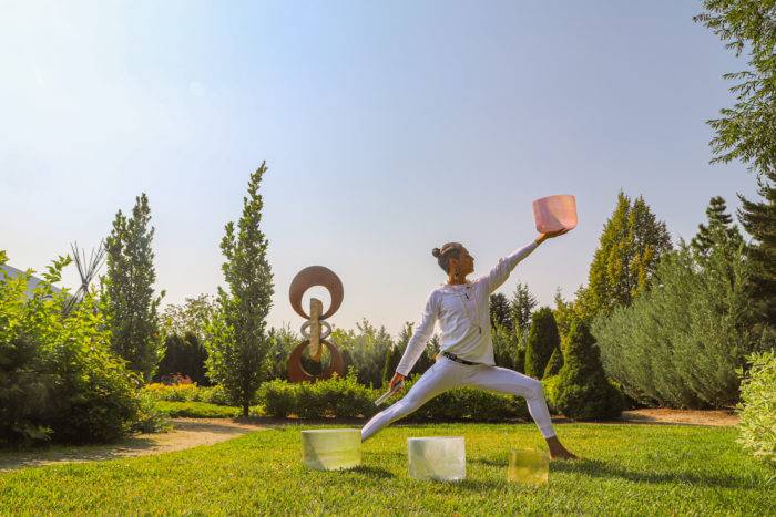 yoga pose at sawtooth botanical gardens