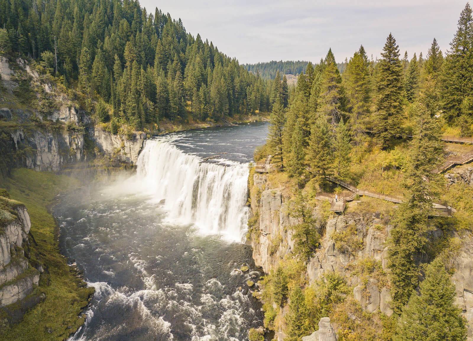 An aerial view of Upper Mesa Falls in full flow.