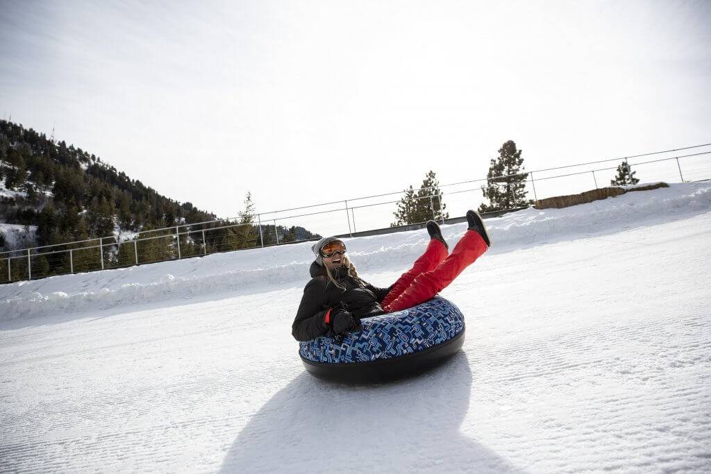 woman snow tubing