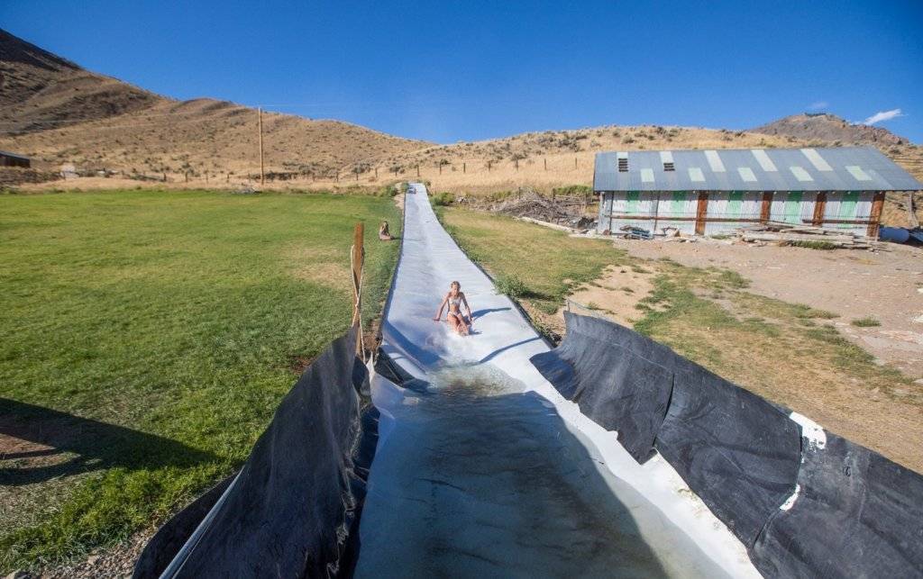 child on waterslide at ranch