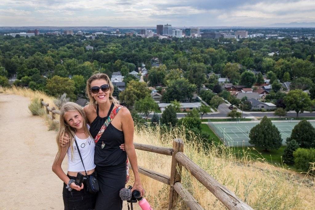 mom and daughter on hill overlooking Boise