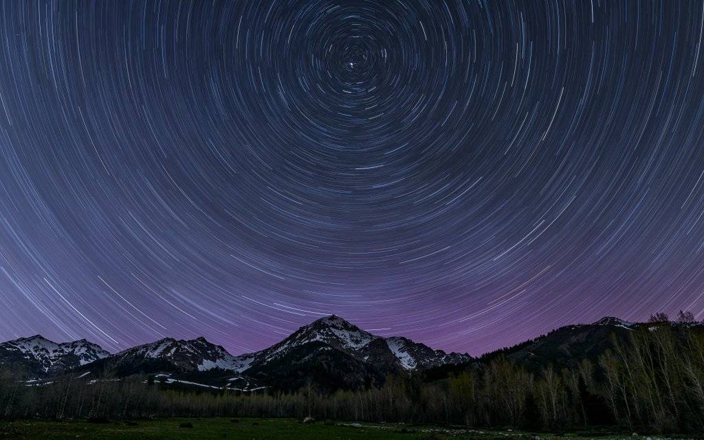 Star trails create a circular motion in the night sky at the Central Idaho Dark Sky Reserve