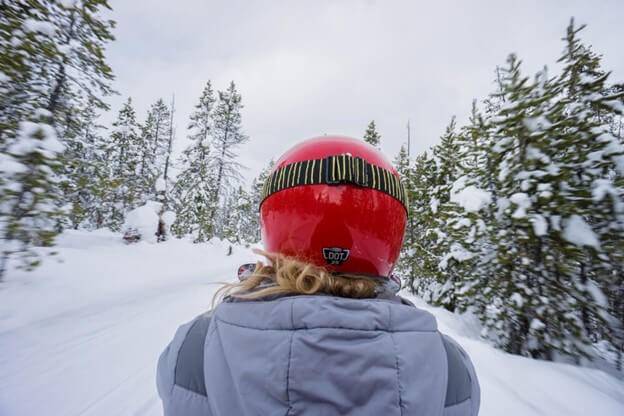 woman on snowmobile near Sun Valley