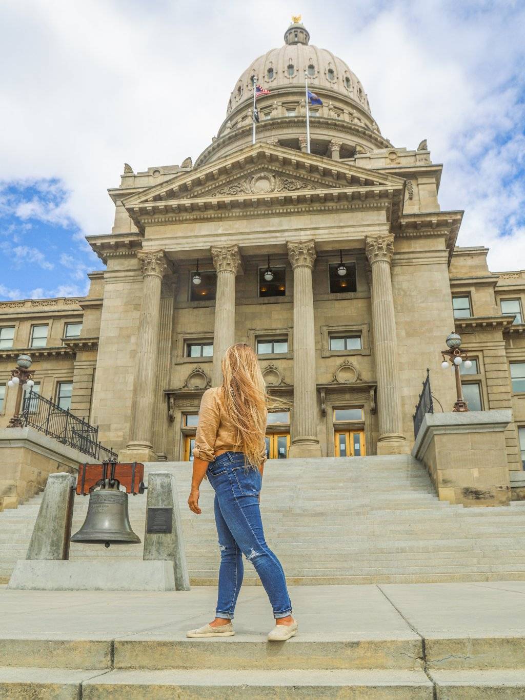 woman in front of Idaho state capitol building