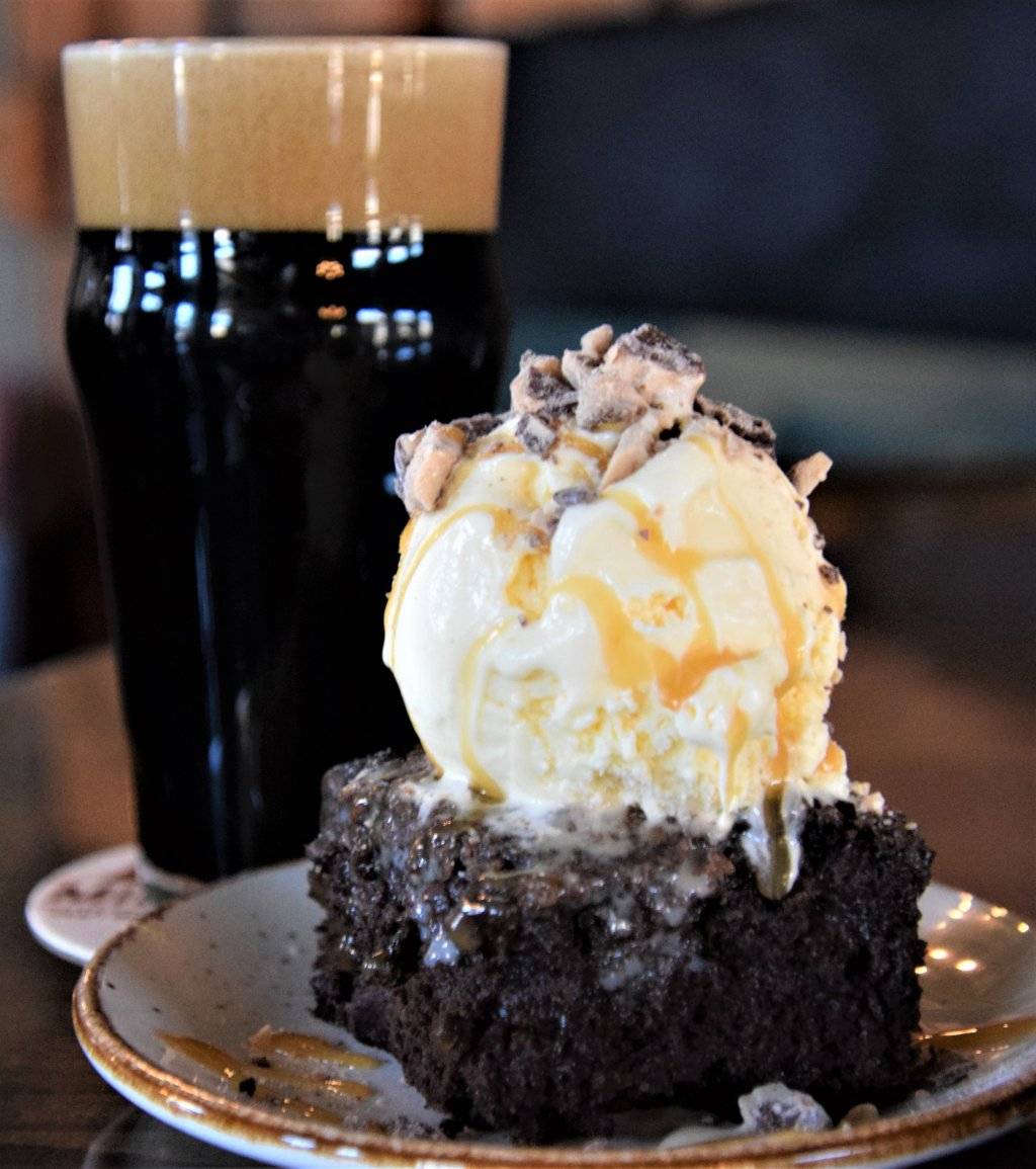 pint of beer with chocolate caramel cake