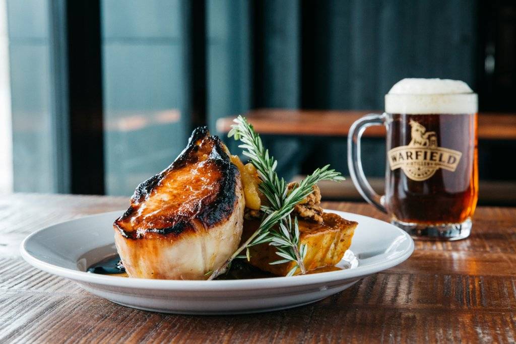 plate of food with pint of beer at warfield distillery