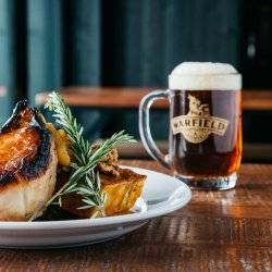 plate of food with pint of beer at warfield distillery