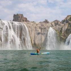 woman in kayak at base of shoshone falls