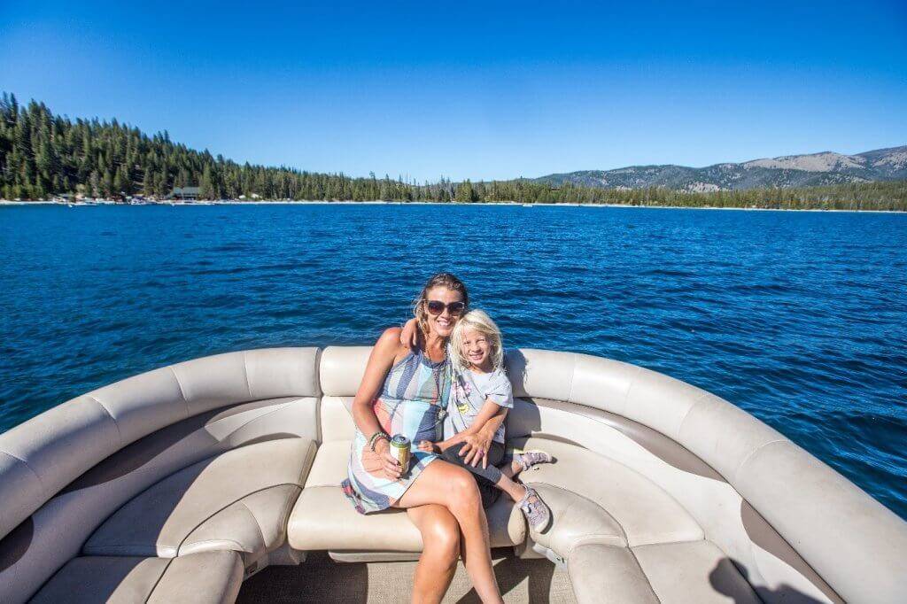 mom and daughter sitting in boat